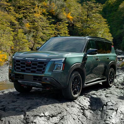2025 Nissan Armada parked on rocky terrain in the wilderness