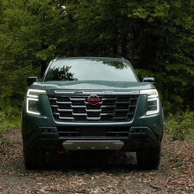 Front view of the 2025 Nissan Armada in a forest setting